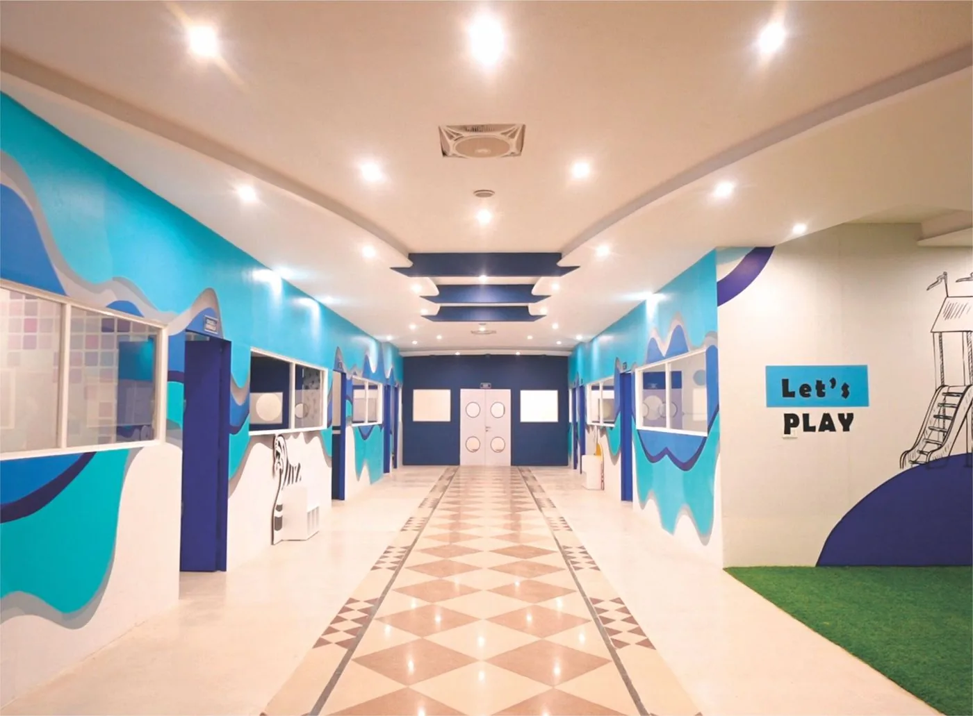 Bright corridor inside London School's Lahore campus with kids' artwork on the walls