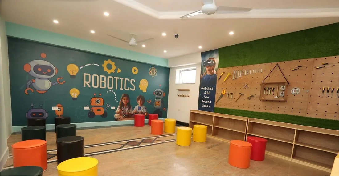 Robotics Lab at London School Lahore with LEGO Mindstorms kits, Arduino boards, and a tool wall